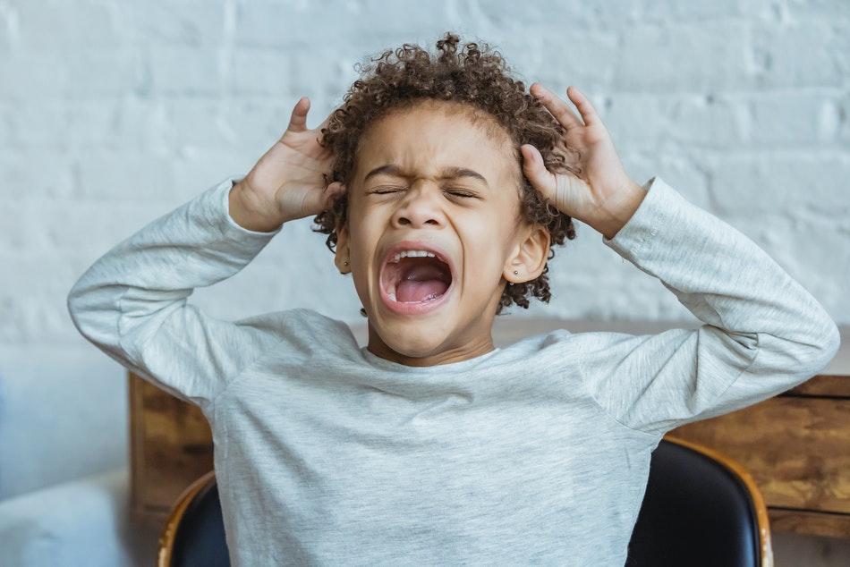 How to quickly calm a screaming child and stop his tantrum?